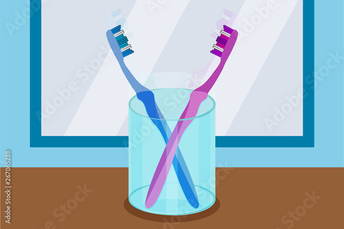 Cepillos de dientes rosa y azul en el cuarto de baño.