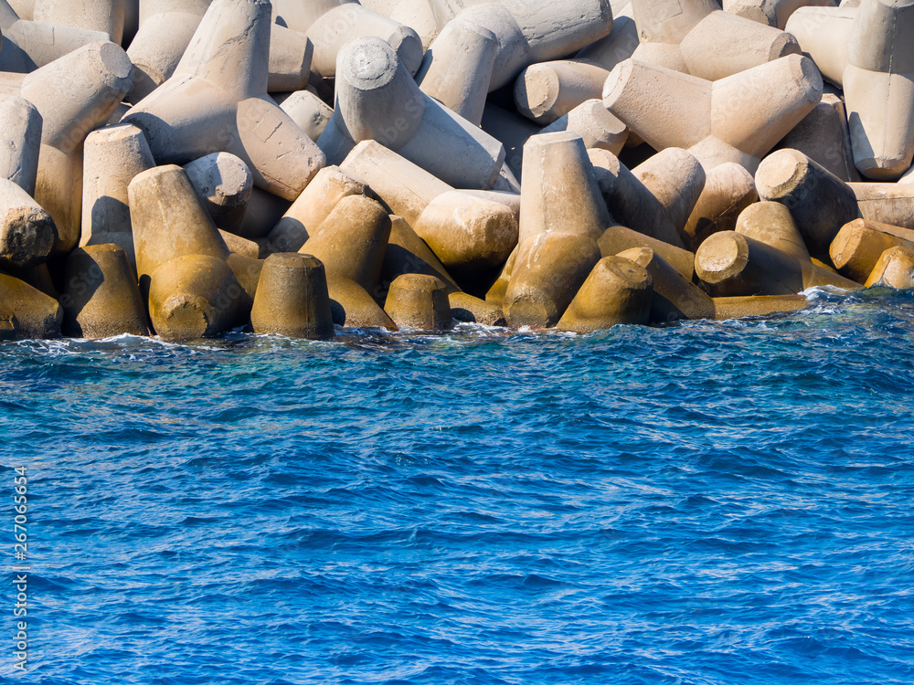 Obraz premium Huge concrete tetrapods near marina on Crete, Greece
