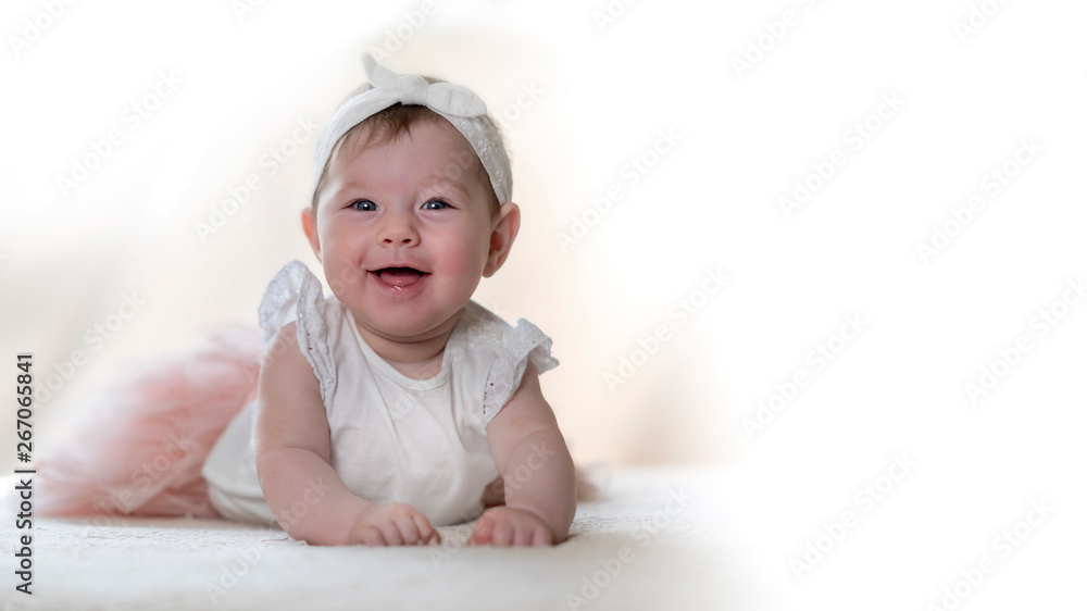 Portrait of a beautiful, smiling girl with a bow on her forehead. Portrait of a beautiful, smiling girl with a bow on her forehead.