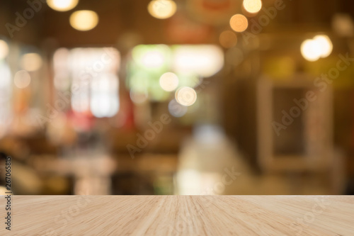 Wooden table of brown in front blurred background, use for presentation product and advertising