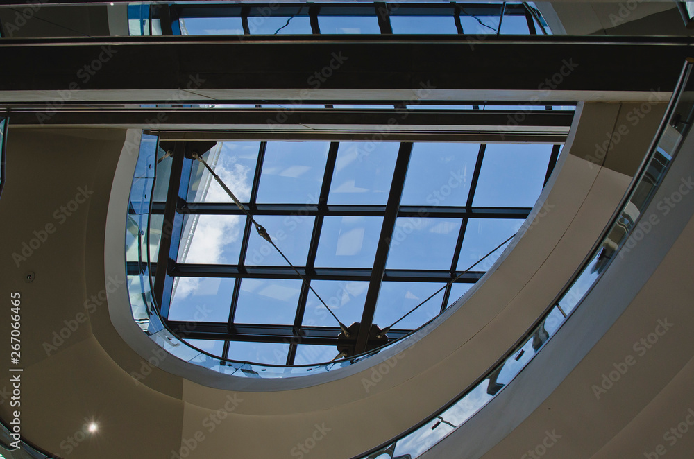 Fototapeta premium The different designs and lines of the glass windows on the ceiling of the downtown library. 