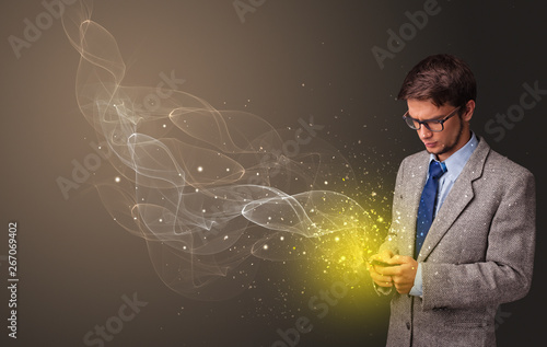 Person using phone with gold sparkling concept 