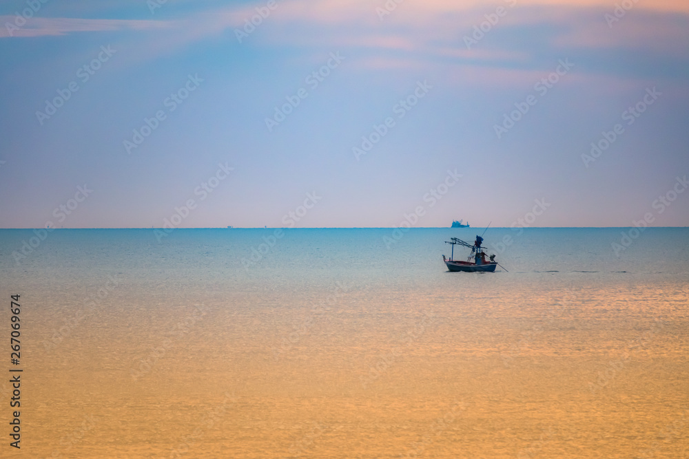 Fishing boat stand at sunrise beach.