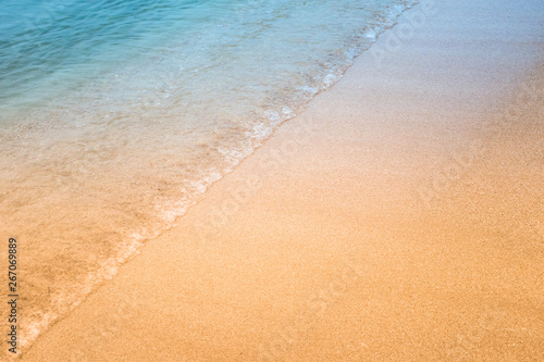 Fototapeta Naklejka Na Ścianę i Meble -  Soft wave of blue ocean on sandy beach.