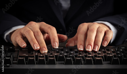 Business woman typing on keyboard 