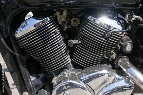 Chrome Cylinders Motorcycle Engine with Light Reflection