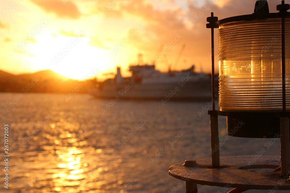 sunset in the background with a navigation light