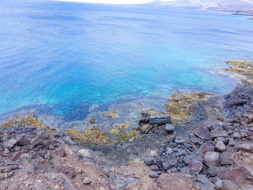 sea coast at volcanic island in Lanzarote, Spain sea coast at volcanic island in Lanzarote, Spain