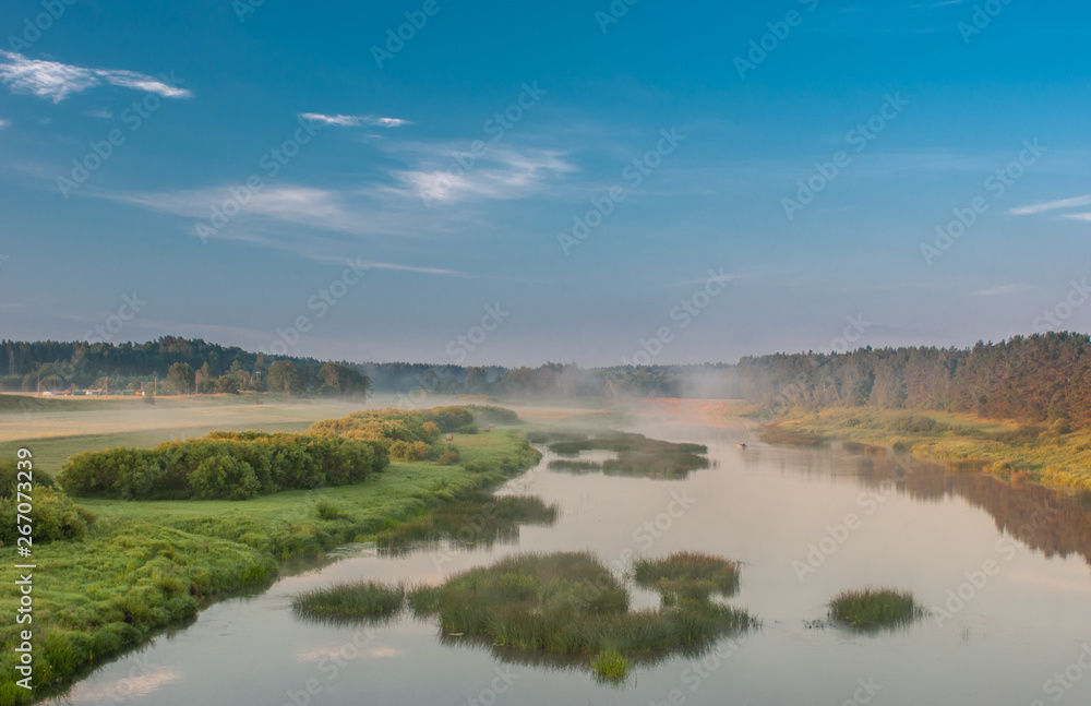 River Venta, Latvia, Kurzeme. morning light plays with fog