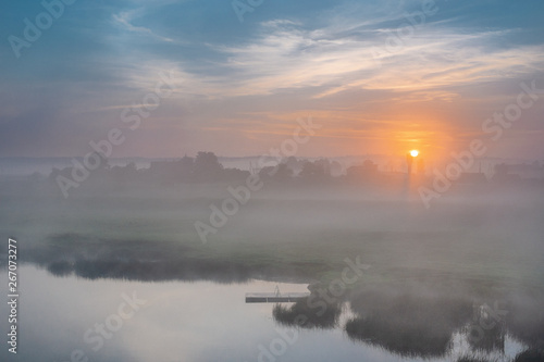 River Venta, Latvia, Kurzeme. morning light plays with fog
