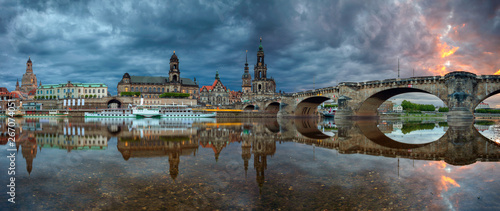 Dresden, Germany. Panoramic cityscape image of Dresden, Germany with reflection of the city in the Elbe river, during dramatic sunset.