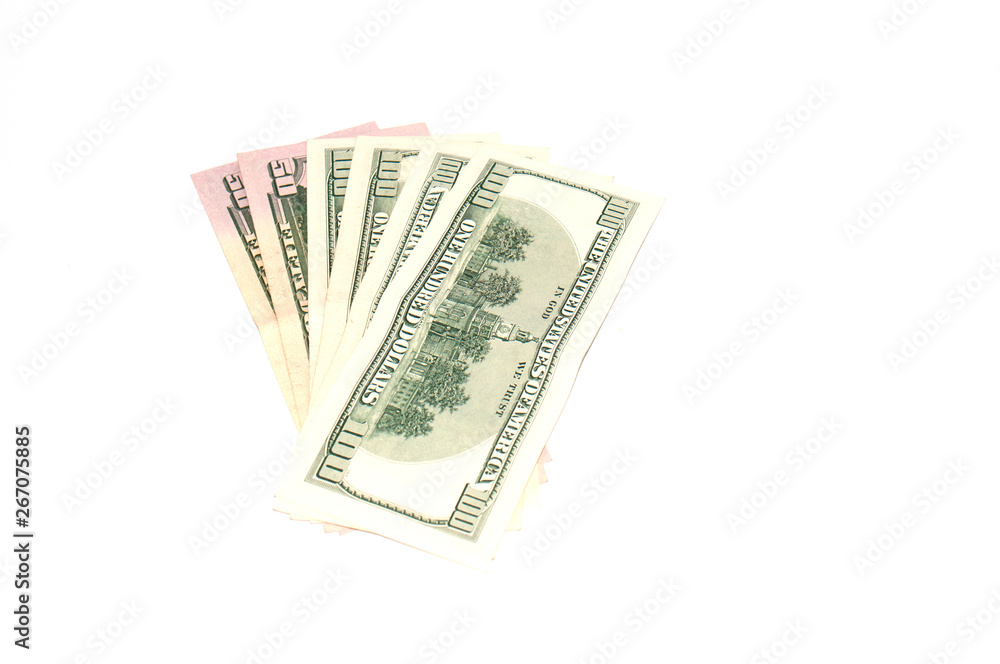 A lot of dollars, American money on a white background, isolate. Concept banking and finance A lot of dollars, American money on a white background, isolate. Concept banking and finance