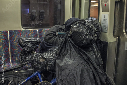 Homeless vagrant on subway train