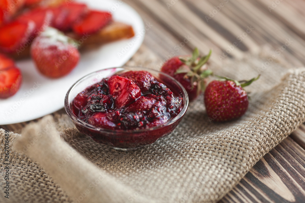 Morning breakfast. Toasts with strawberry and jam. Bread and confiture. Fresh hot toasts with cream. Delicious homemade dessert. Morning breakfast. Toasts with strawberry and jam. Bread and confiture. Fresh hot toasts with cream. Delicious homemade dessert.