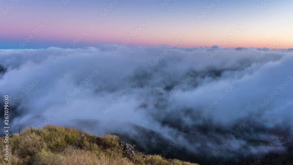 Magic morning above foggy clouds moving in valley in New Zealand mountains nature Time lapse