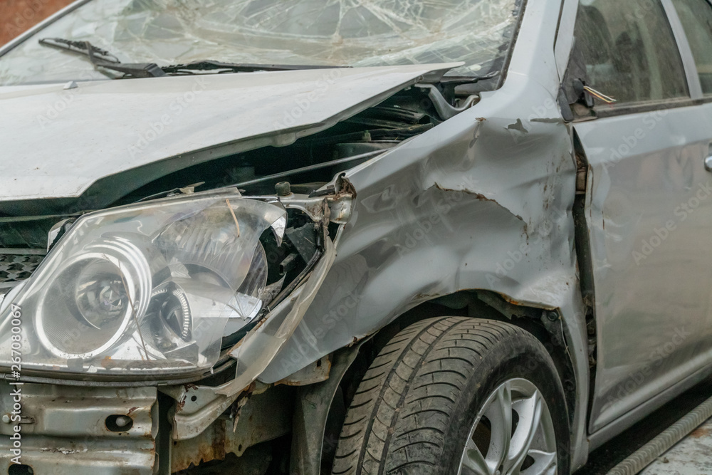 broken gray car close up. accident concept broken gray car close up. accident concept