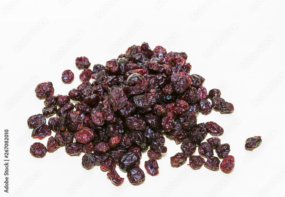 Pile of dried cranberries Dried cranberries in a bowl on white background. Closeup Pile of dried cranberries Dried cranberries in a bowl on white background. Closeup