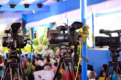 Photography Video journalist capturing moving picture by camcorder in a event