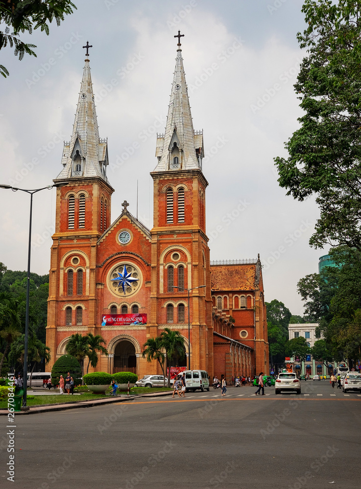 HO CHI MINH, VIETNAM - 25.12.2016. Notre Dame Cathedral (Vietnamese: Nha Tho Duc Ba) in sunny day. Build in 1883 in Ho Chi Minh city, Vietnam. HO CHI MINH CITY (SAI GON)