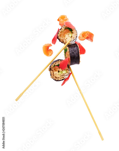 Sushi pieces placed between chopsticks, separated on white background. Popular sushi food