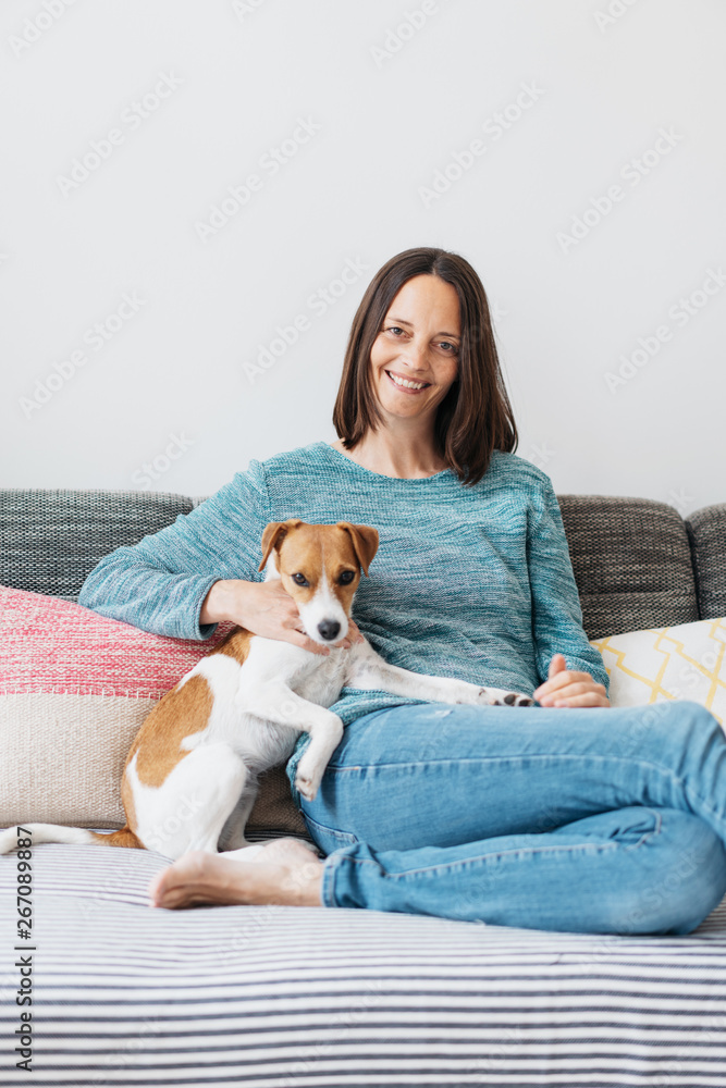 Happy smiling woman with a cute little dog Happy smiling woman with a cute little dog