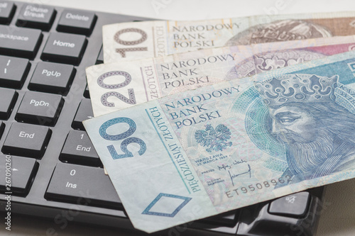 Concept: Different types of Polish money and keyboard