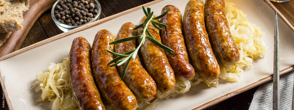 Grilled Sausages with Cabbage Salad, Mustard and Beer. Bratwurst and Sauerkraut.