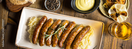Grilled Sausages with Cabbage Salad, Mustard and Beer. Bratwurst and Sauerkraut.