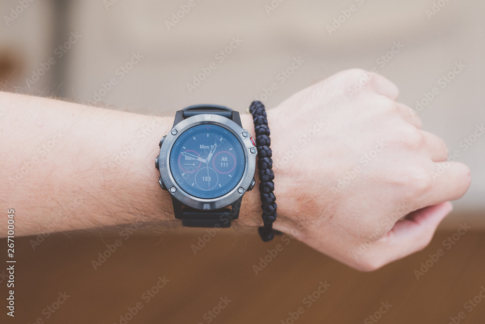 Runner checking progress on smart watch Runner checking progress on smart watch