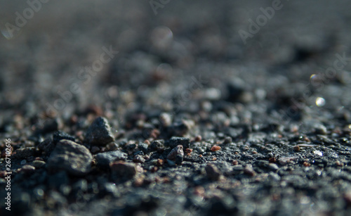 Close up on gravel on a gravel road in the summertime
