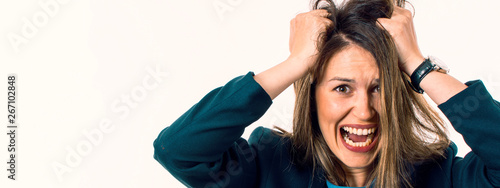 Screaming Woman is Going Crazy Pulling Her Hair. Stress Concept.