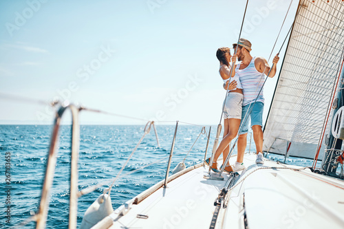 Man and woman enjoying on luxury boat.