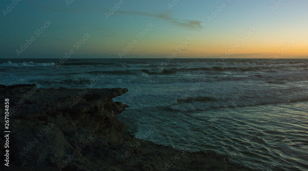 sunset sea rocks waves water