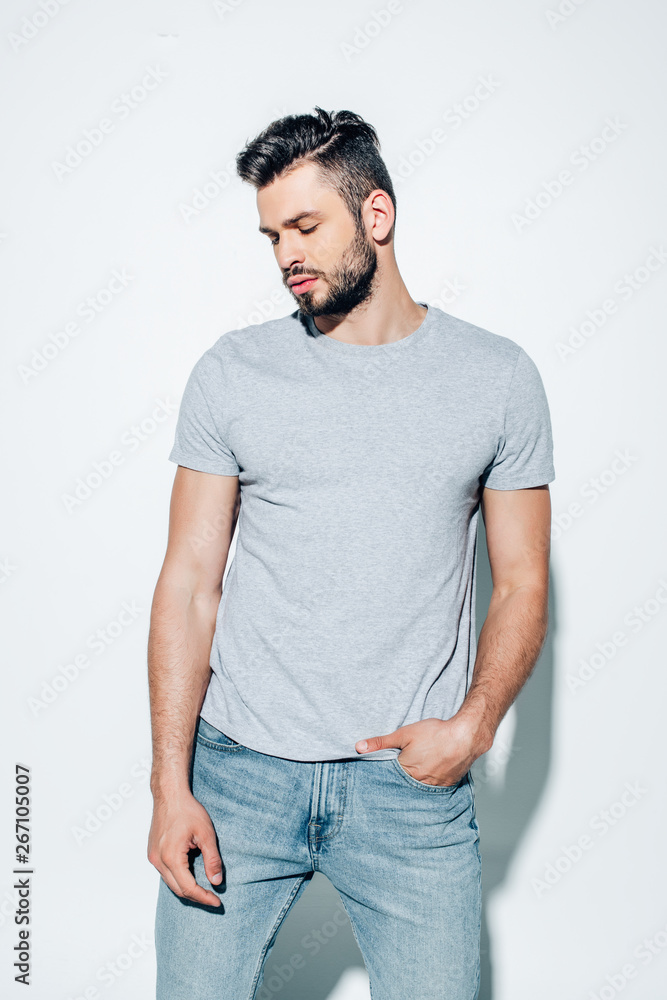 handsome bearded man standing with hand in pocket on white handsome bearded man standing with hand in pocket on white