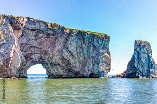 Closeup of Rocher Perce rock in Gaspe Peninsula, Quebec, Gaspe area with birds and cliffs  photo