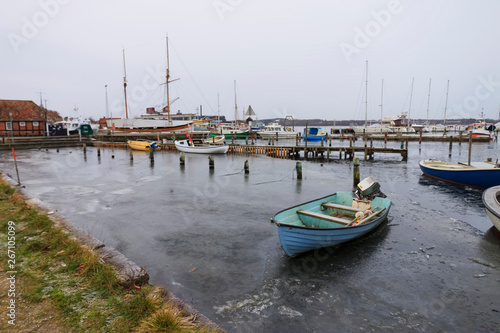 Boat in the frozen waters of Mariager fjord, Jutland, Denmark