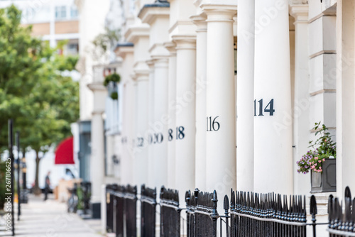 London neighborhood district of Pimlico with terraced housing balconies buildings and numbers on columns in old retro vintage traditional style flats photo