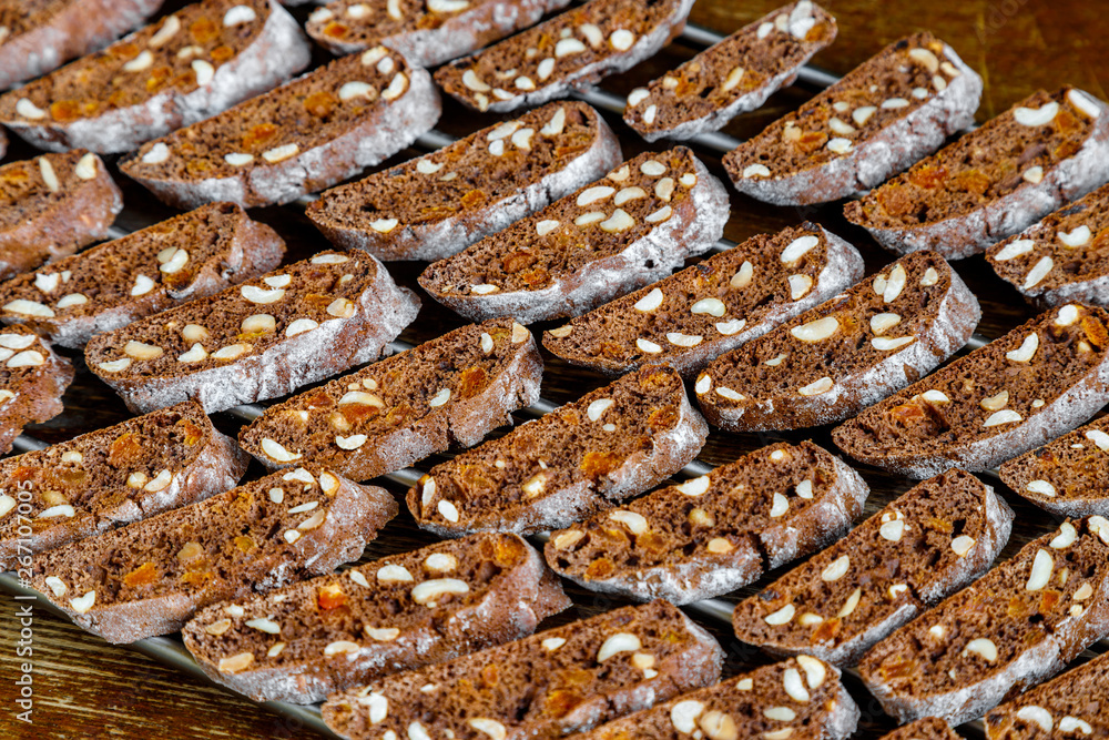 Freshly baked chocolate biscotti with nuts and dried fruits close-up