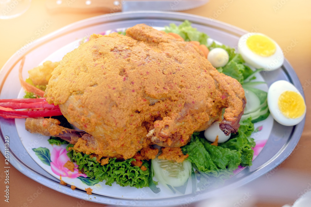 roasted curry chicken with eggs in a plate. Selective focus roasted curry chicken with eggs in a plate. Selective focus