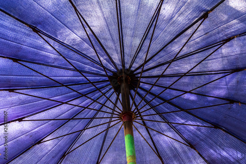Large blue umbrella on the beach
