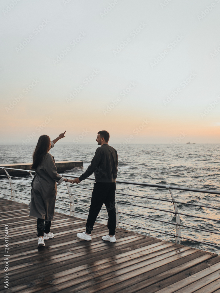 Fototapeta premium beautiful loving couple walking at sunset