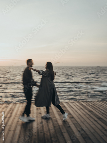  beautiful loving couple walking at sunset