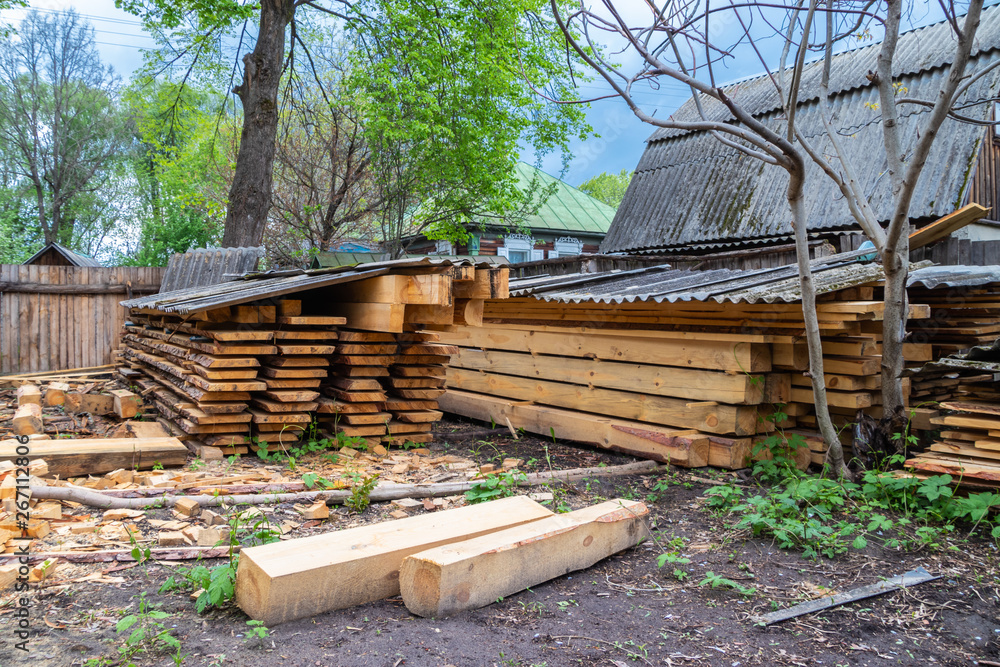 Timber stacked in piles for industrial storage Timber stacked in piles for industrial storage