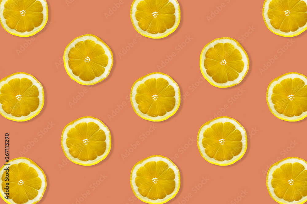 Creative pattern made of lemon. top view of fruit fresh limes slices on orange & yellow colorful background. Creative pattern made of lemon. top view of fruit fresh limes slices on orange & yellow colorful background.