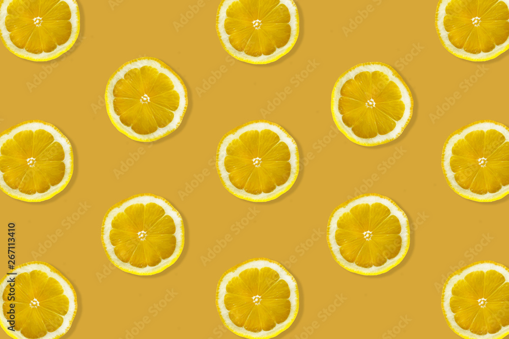 Creative pattern made of lemon. top view of fruit fresh limes slices on orange & yellow colorful background. Creative pattern made of lemon. top view of fruit fresh limes slices on orange & yellow colorful background.