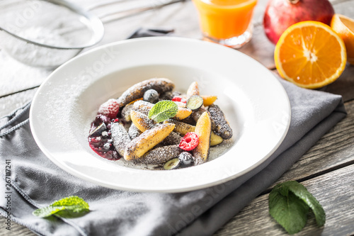 Potato dumplings sulance gnocci with milled poppy seeds shugar powder and marmalade. Traditional slovak czech and austrian sweet food