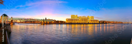 Main Building of the Ministry of Defence of the Russian Federation (Minoboron), at night-- is the governing body of the Russian Armed Forces and Moskva River (panorama). Moscow, Russia