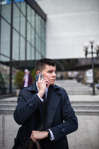 Urban businessman talking on the smartphone