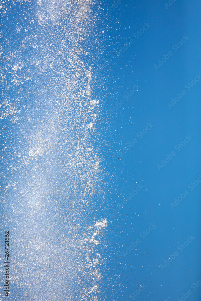 Splashes of water against the blue sky
