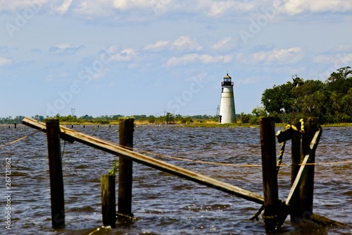 Madisonville Light House along the shore of Lake Pontchartrain in Madisonville, Louisiana on a sunny spring day photo